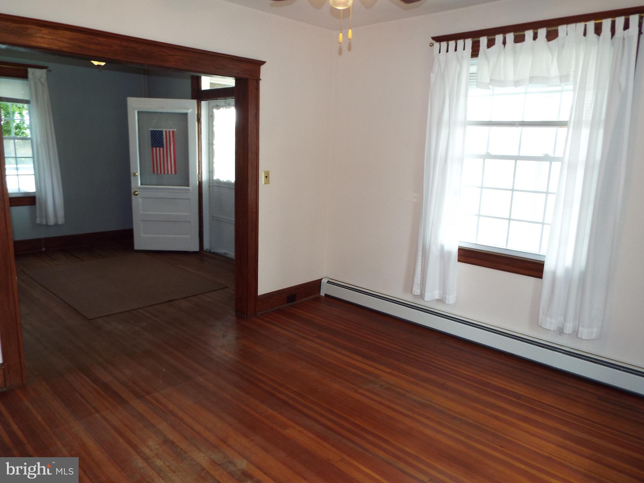 7210 Dogwood Road Baltimore, MD 21244 - Photo 4 of 36 Living room to foyer view.