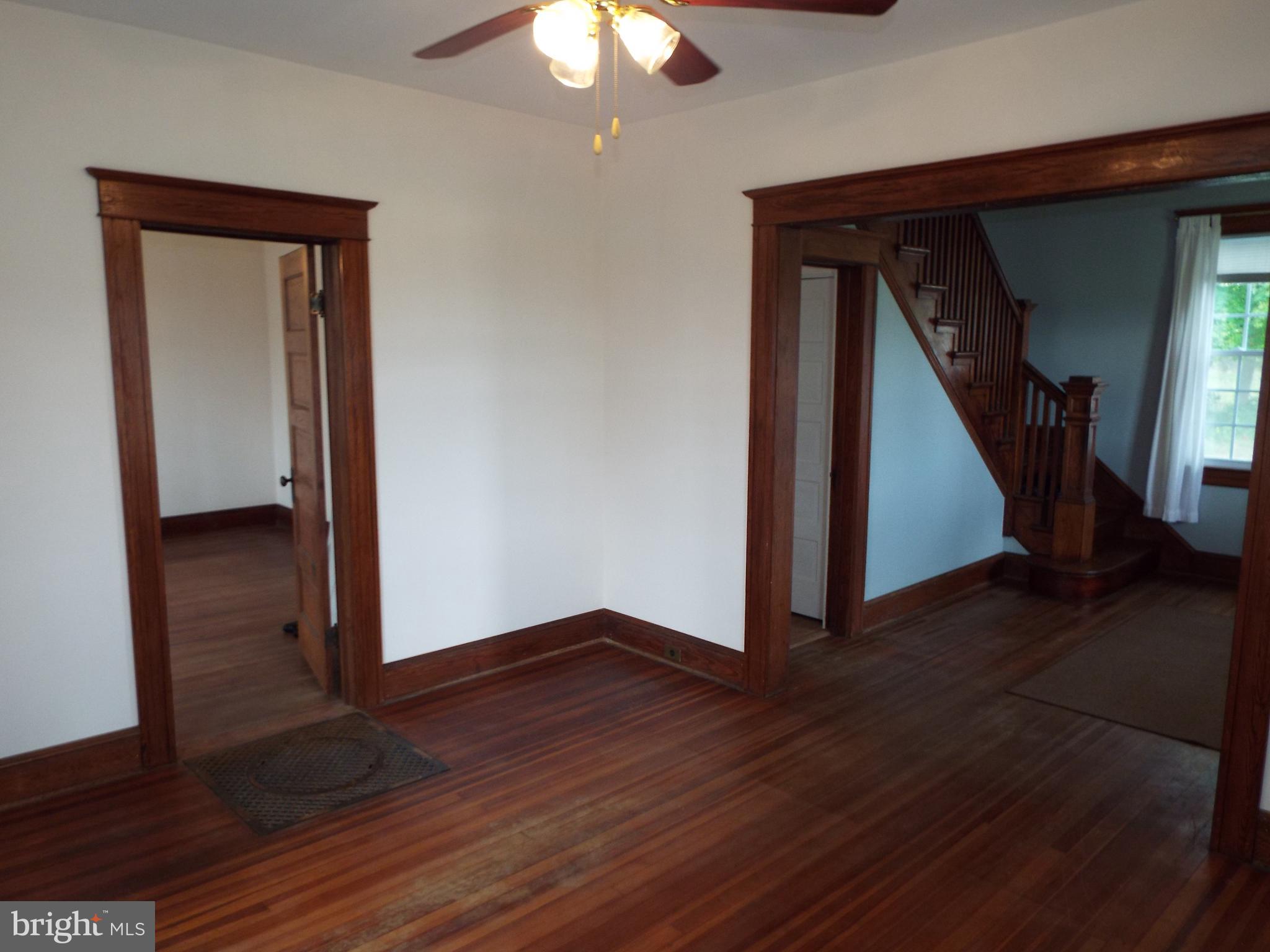 7210 Dogwood Road Baltimore, MD 21244 - Photo 6 of 36 Living room to dining room & foyer view.