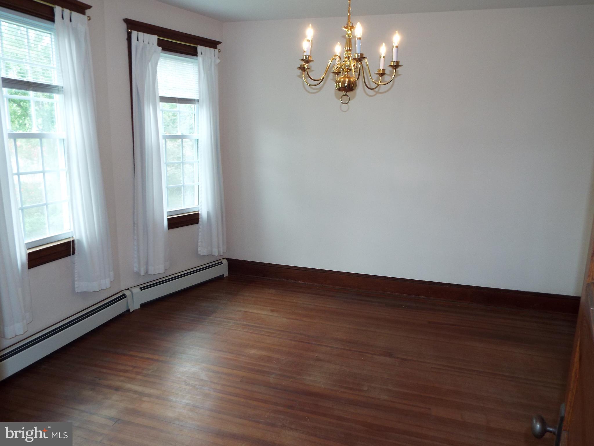 7210 Dogwood Road Baltimore, MD 21244 - Photo 7 of 36 Dining room with rich hardwood flooring.