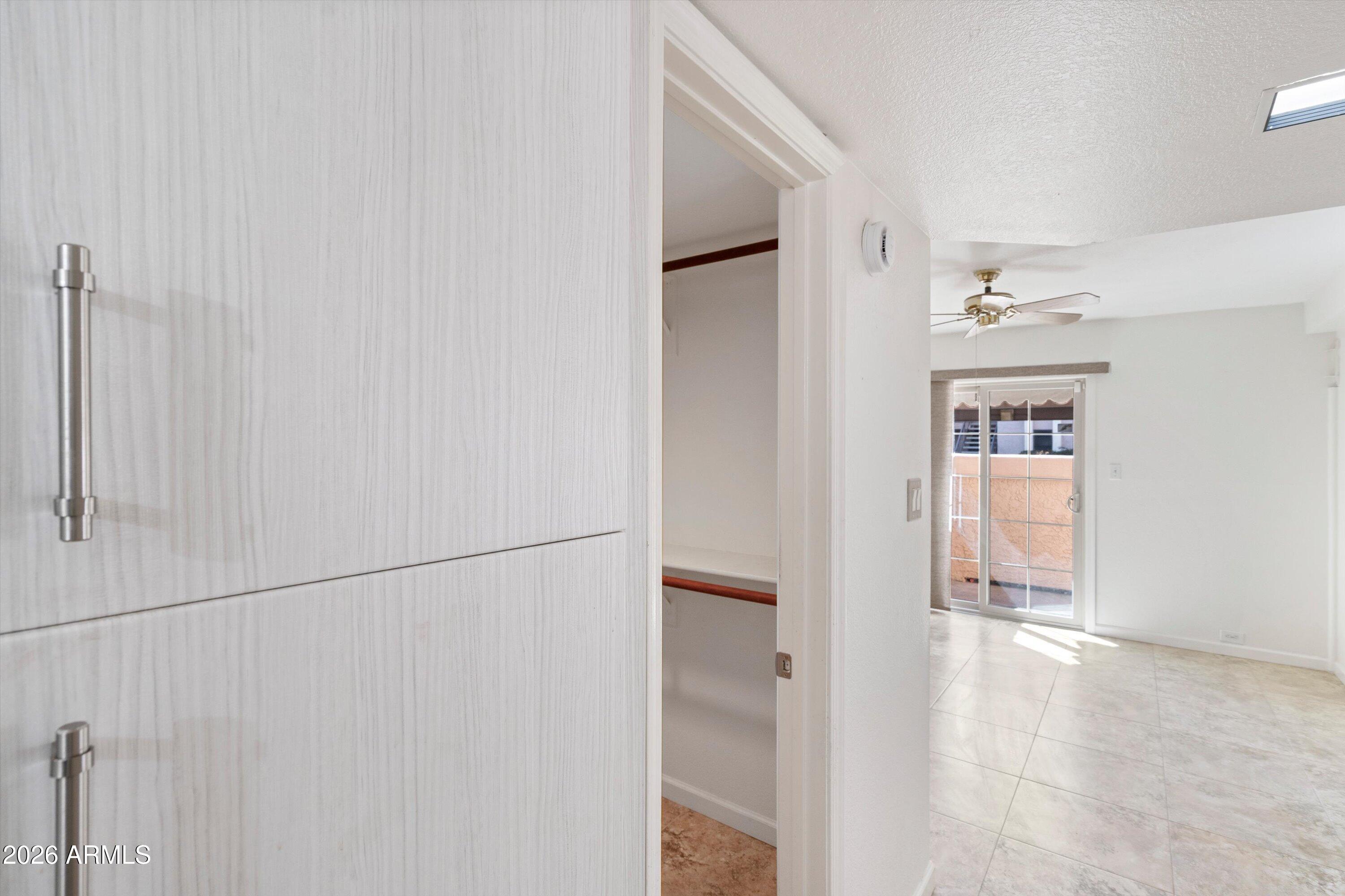 10410 North Cave Creek Road, Unit 1031 Phoenix, AZ 85020 - Photo 18 of 28 a view of a hallway with wooden floor and entryway