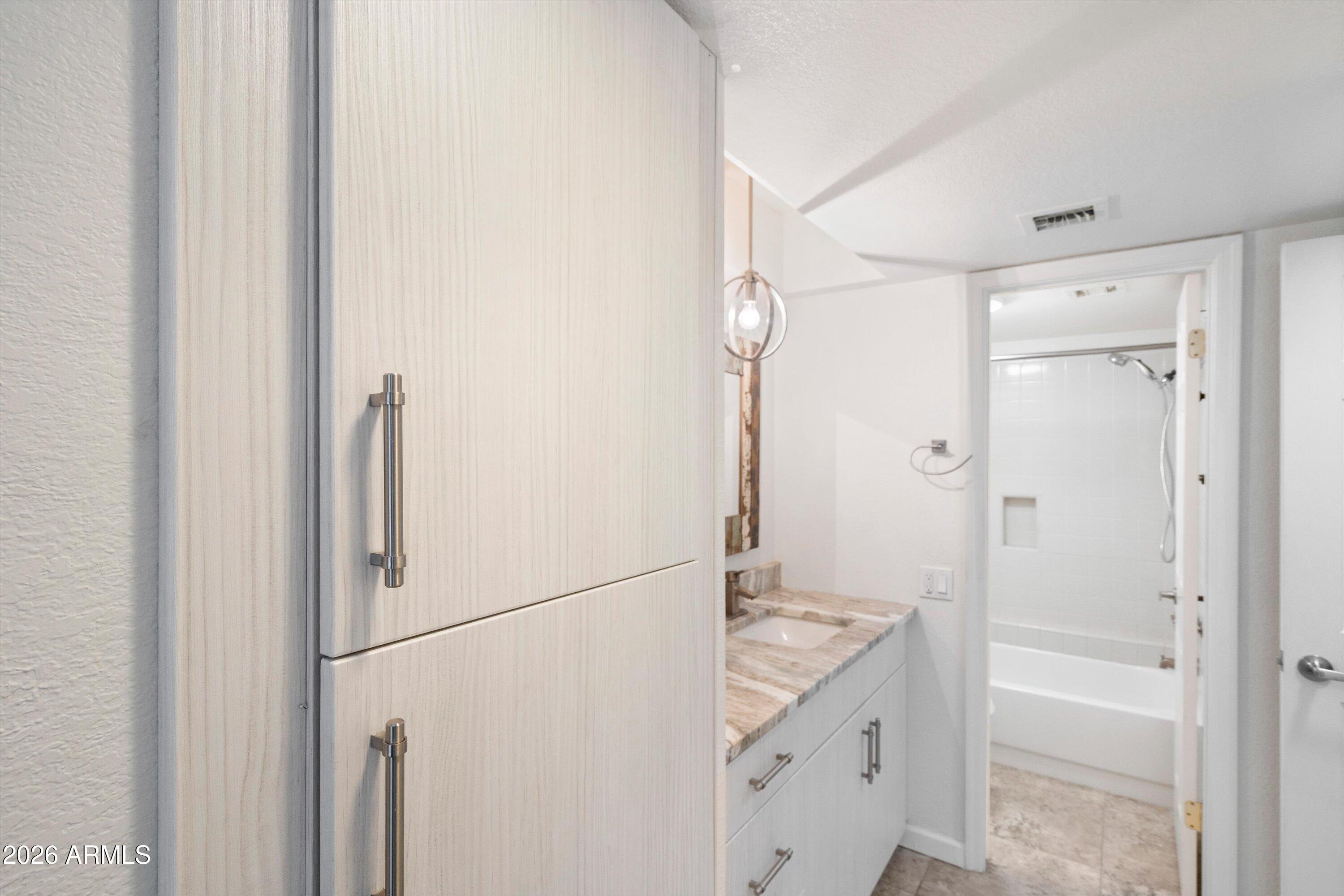 10410 North Cave Creek Road, Unit 1031 Phoenix, AZ 85020 - Photo 23 of 28 a bathroom with a shower and a sink