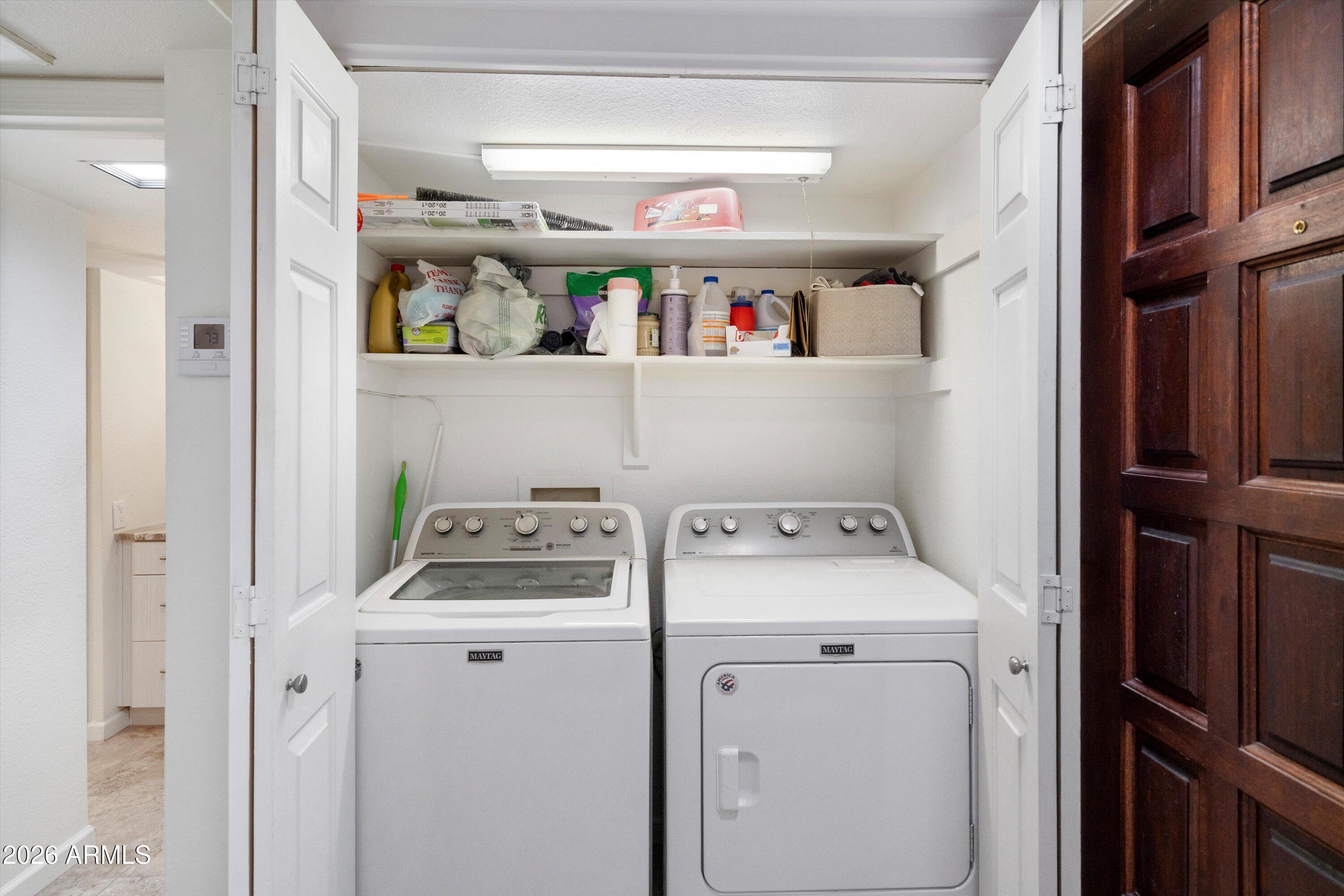 10410 North Cave Creek Road, Unit 1031 Phoenix, AZ 85020 - Photo 25 of 28 a utility room with dryer and washer