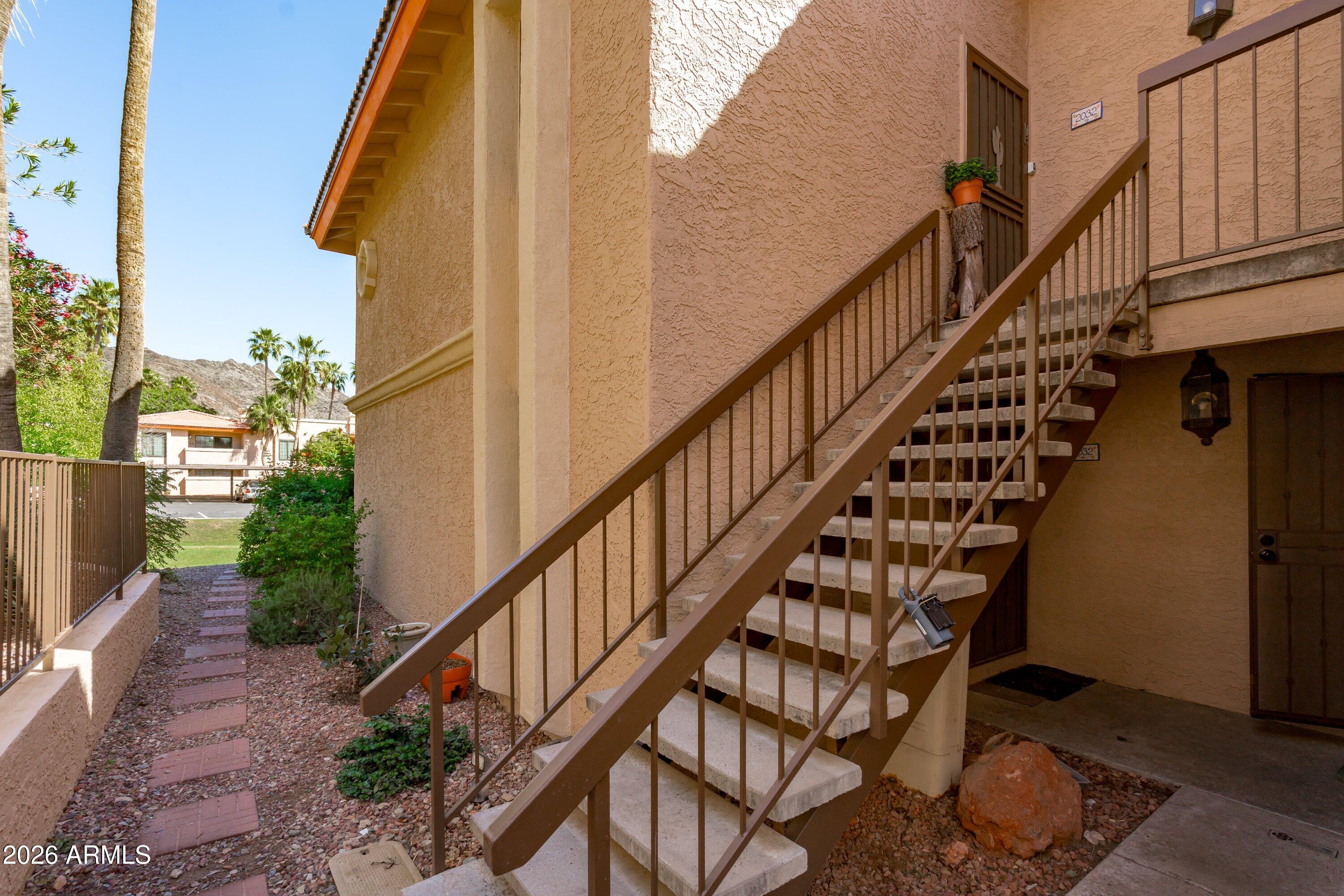 10410 North Cave Creek Road, Unit 1031 Phoenix, AZ 85020 - Photo 28 of 28 a view of entryway with wooden floor and stairs