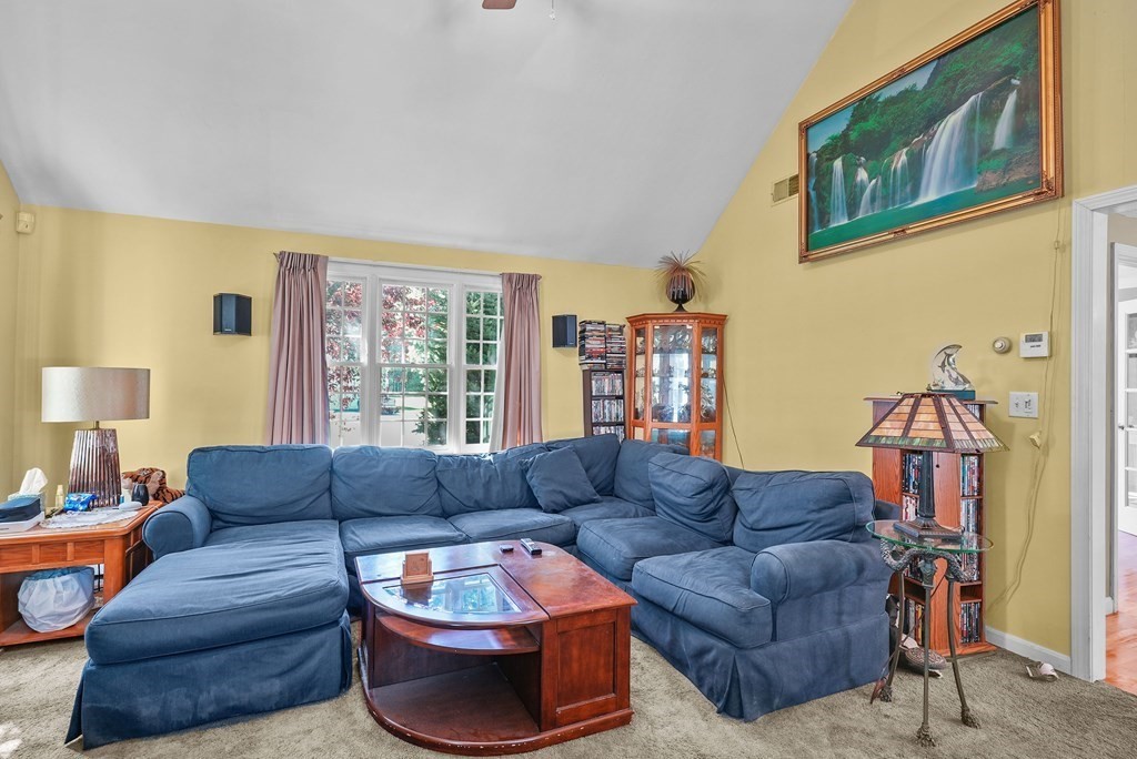 2 Commons Drive Carver, MA 02330 - Photo 12 of 37 a living room with furniture a couch and a window