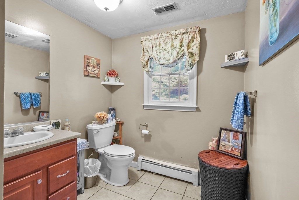 2 Commons Drive Carver, MA 02330 - Photo 14 of 37 a bathroom with a toilet sink and mirror