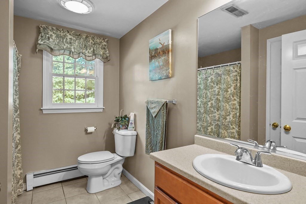 2 Commons Drive Carver, MA 02330 - Photo 18 of 37 a bathroom with a toilet sink and mirror