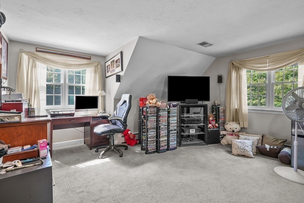 2 Commons Drive Carver, MA 02330 - Photo 27 of 37 a living room with furniture and a flat screen tv
