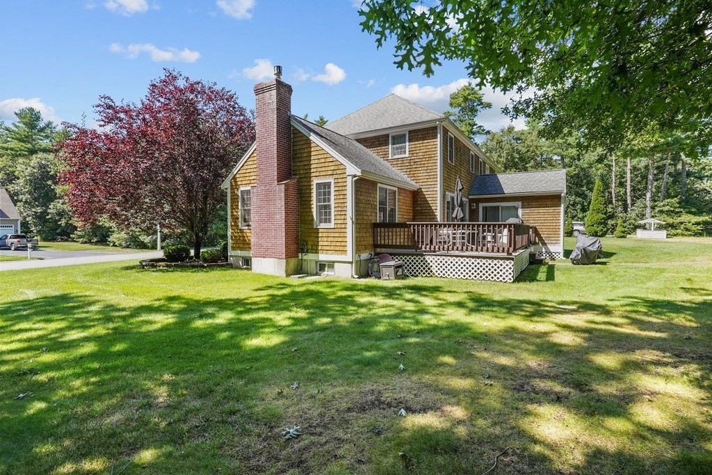 2 Commons Drive Carver, MA 02330 - Photo 34 of 37 a front view of house with yard and green space