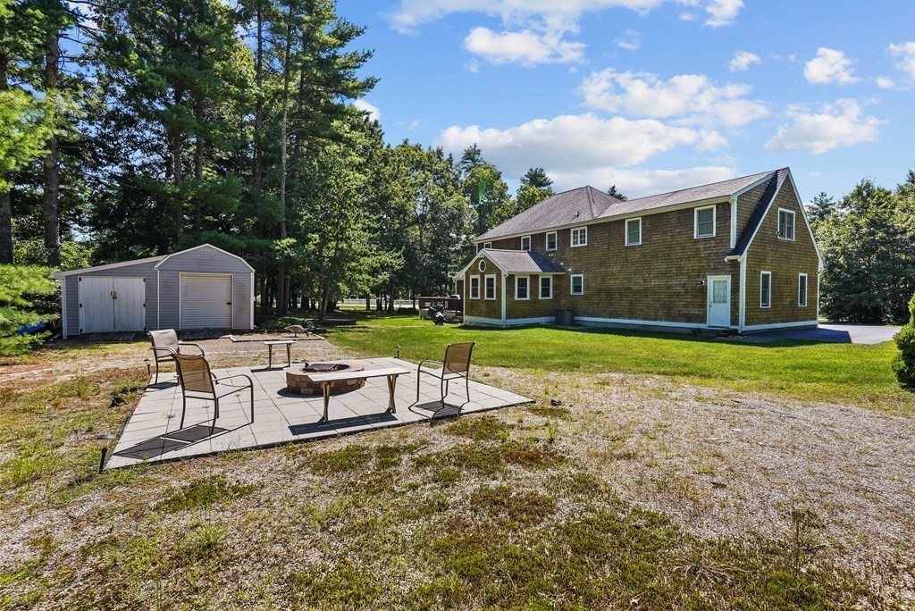 2 Commons Drive Carver, MA 02330 - Photo 35 of 37 a view of a house with a yard