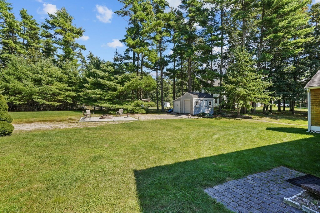 2 Commons Drive Carver, MA 02330 - Photo 37 of 37 a view of swimming pool with an outdoor space and seating area