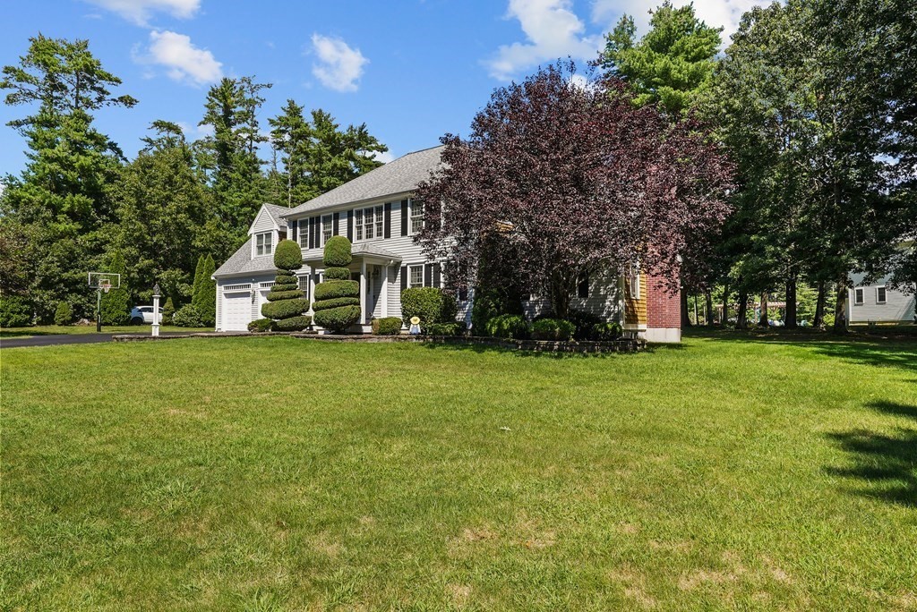 2 Commons Drive Carver, MA 02330 - Photo 5 of 37 a view of house with garden and trees