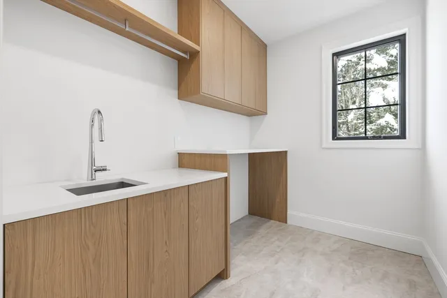 a kitchen with stainless steel appliances a sink and a cabinets