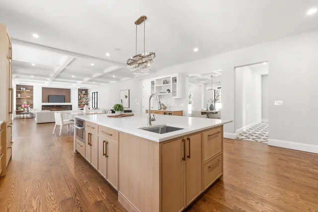 a kitchen with stainless steel appliances granite countertop a sink and stove