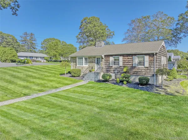 front view of a house with a yard