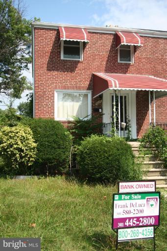 5010 West Hills Road Baltimore, MD 21229 - Photo 1 of 30 front view of a house with a yard