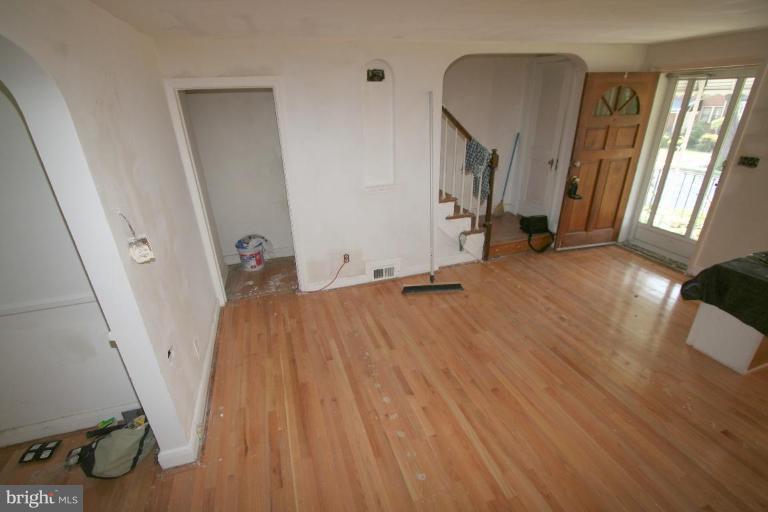 5010 West Hills Road Baltimore, MD 21229 - Photo 11 of 30 a view of a room with wooden floor and windows