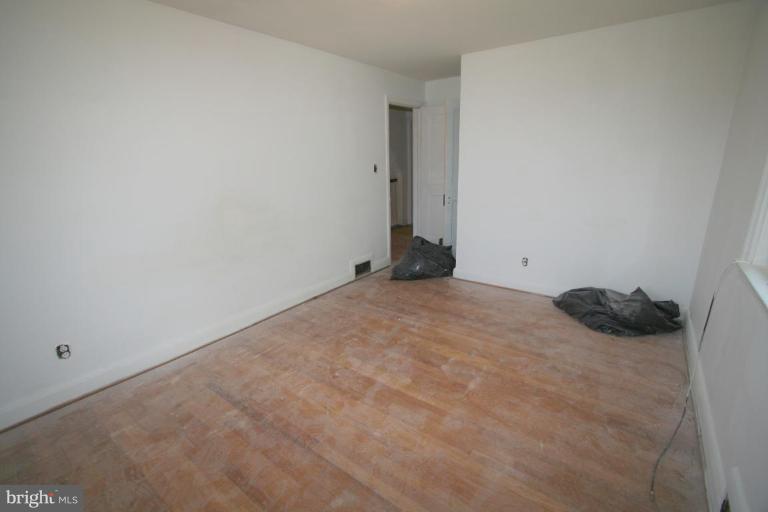 5010 West Hills Road Baltimore, MD 21229 - Photo 21 of 30 a view of a room with a bed and window