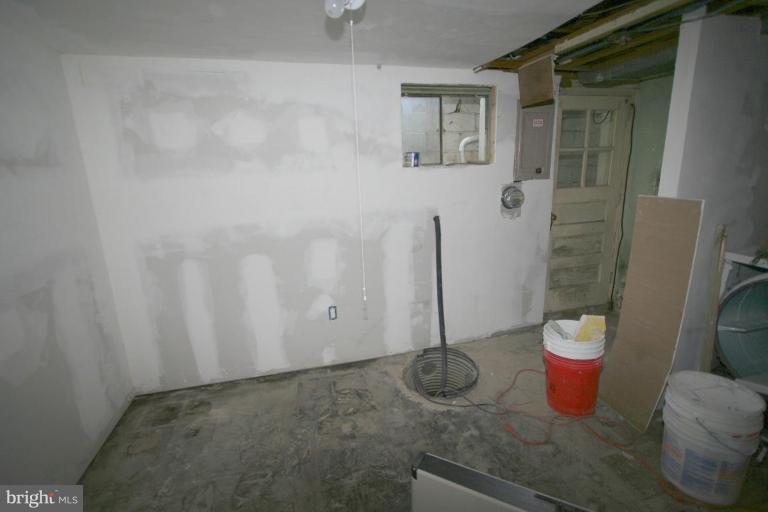 5010 West Hills Road Baltimore, MD 21229 - Photo 29 of 30 a bathroom with a granite countertop sink and a mirror