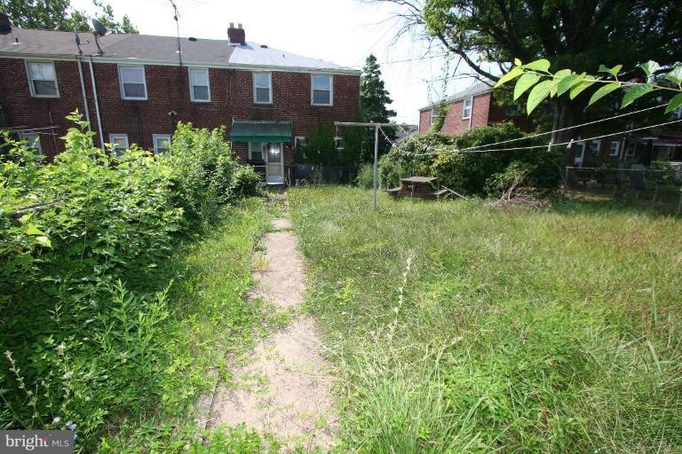 5010 West Hills Road Baltimore, MD 21229 - Photo 4 of 30 a view of a house with a yard and plants