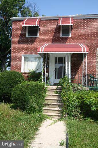 5010 West Hills Road Baltimore, MD 21229 - Photo 7 of 30 a view of a house with a yard