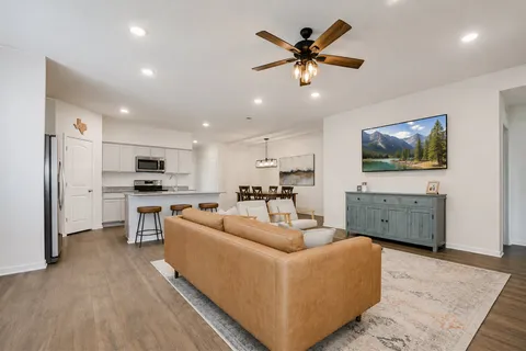 a view of kitchen with furniture and wooden floor