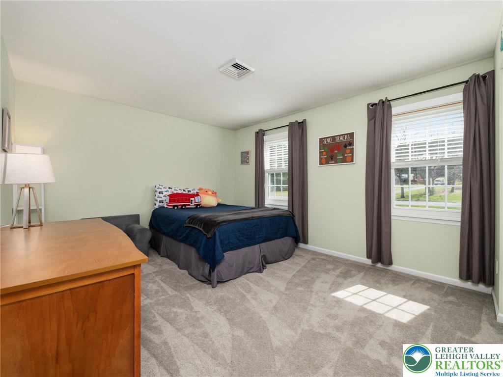 861 Point Phillips Road Bath, PA 18014 - Photo 16 of 32 a bedroom with a bed and a table