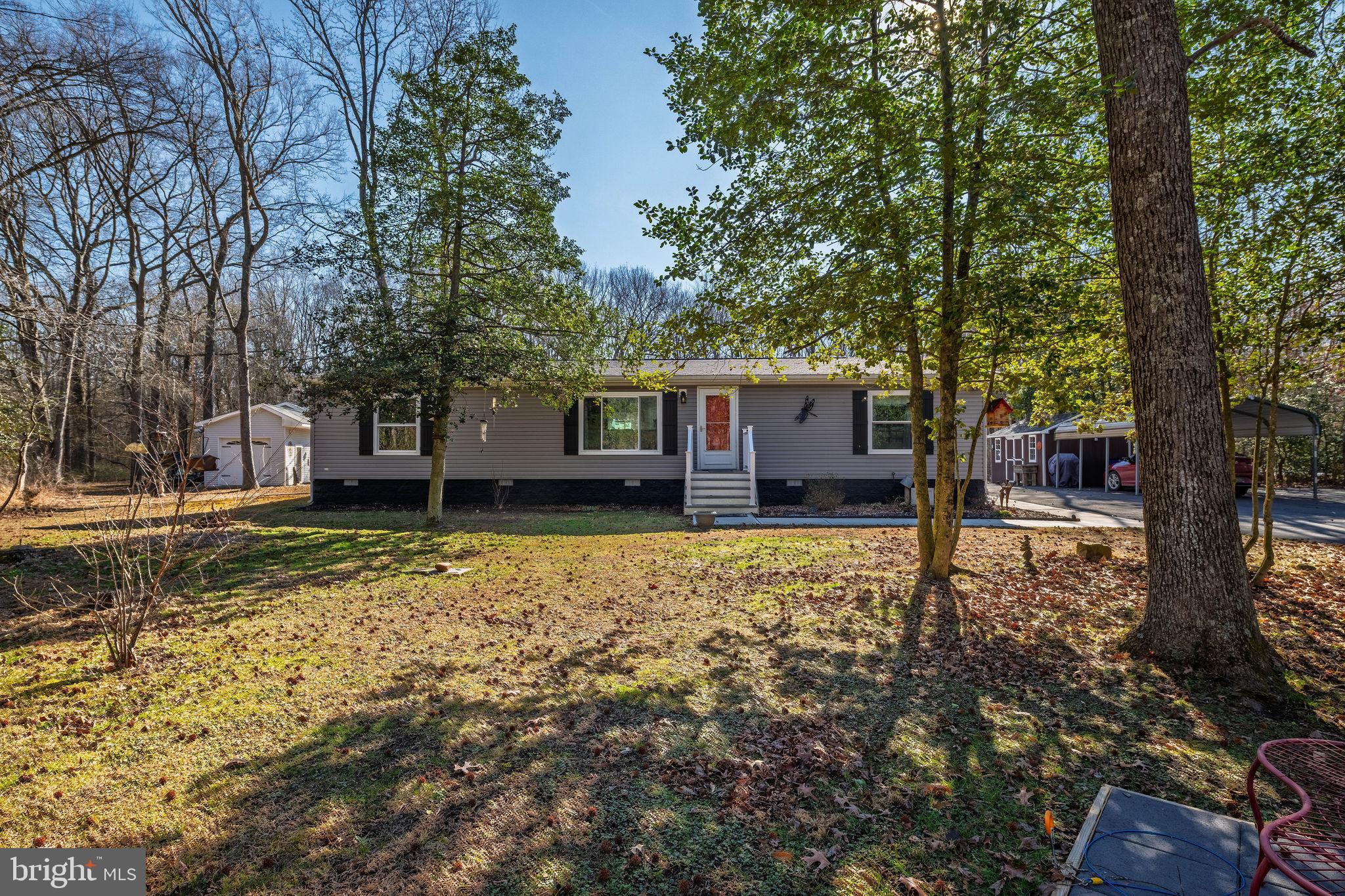 a view of house with a backyard space