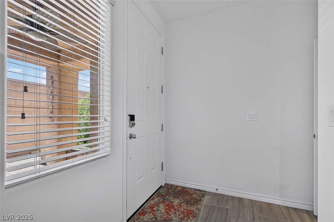 1824 Redland Ridge Street Henderson, NV 89002 - Photo 22 of 69 A welcoming entry featuring a white door and wood-look flooring.