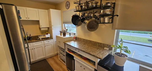 a view of a dining room with furniture and window
