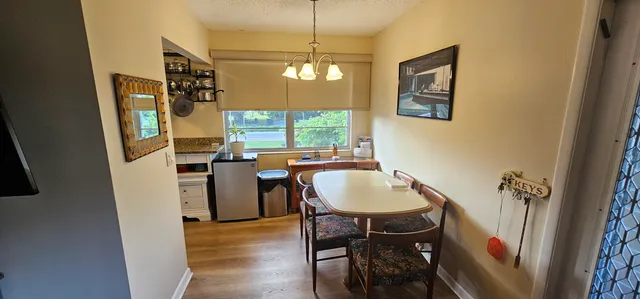 a living room with furniture and book shelf
