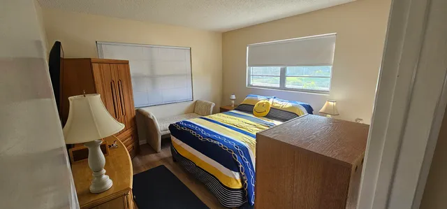 a bathroom with a sink toilet and mirror