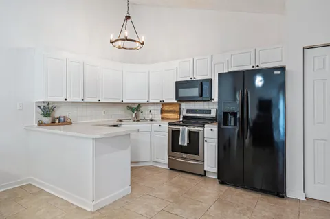 an aerial view of a house with a swimming pool