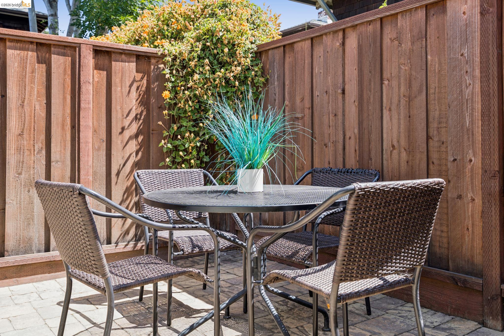 1701 Derby Street Berkeley, CA 94703 - Photo 34 of 39 Paved patio with an adjacent wooden privacy fence