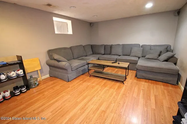 a living room with a couch and a flat screen tv