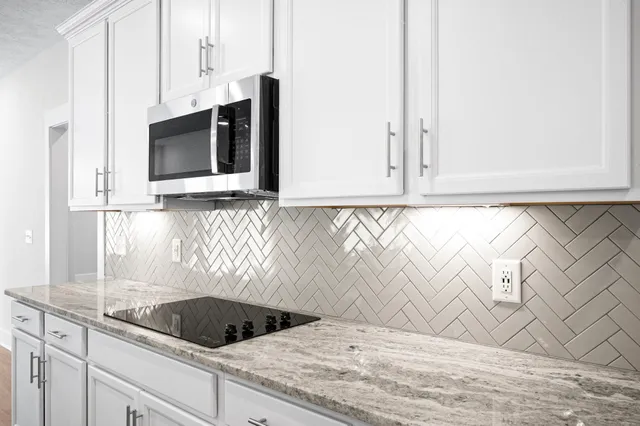 a kitchen with a sink and cabinets