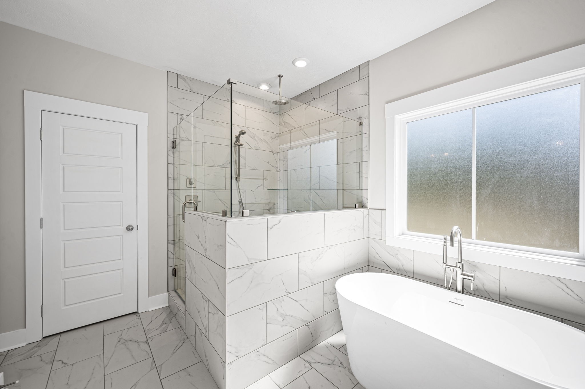 48 Powell Road Clarksville, TN 37043 - Photo 30 of 54 a bathroom with a bathtub and a shower