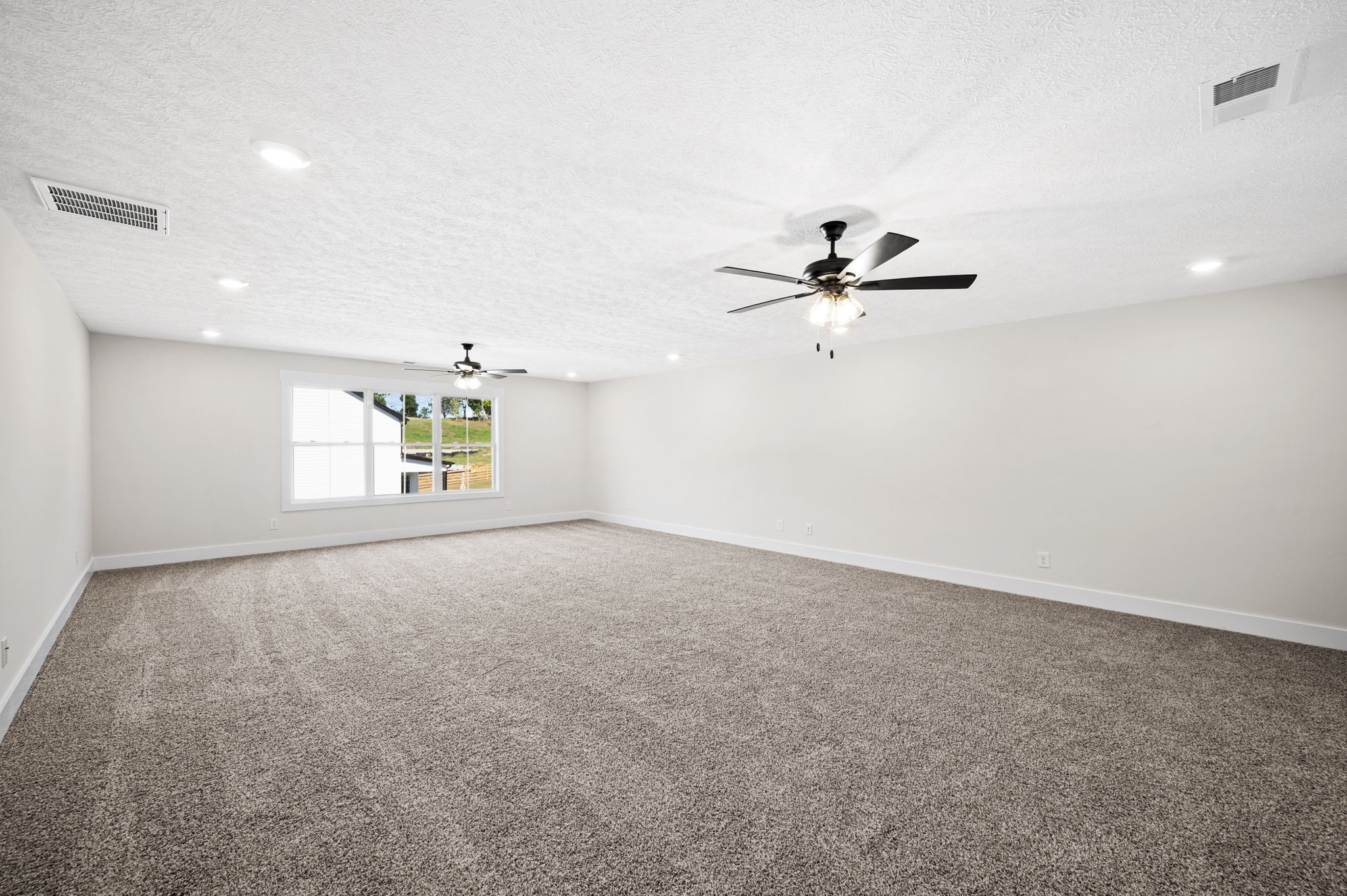 48 Powell Road Clarksville, TN 37043 - Photo 40 of 54 an empty room with windows and ceiling fan