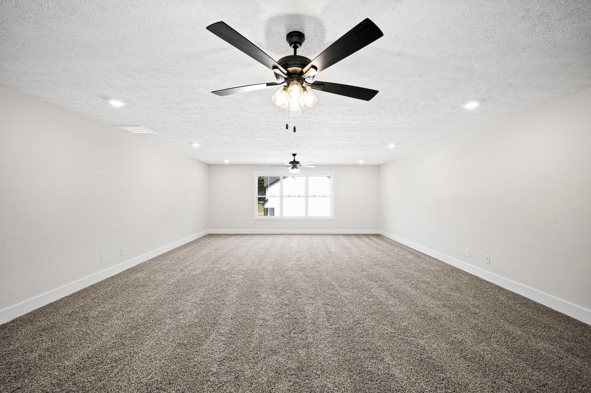 48 Powell Road Clarksville, TN 37043 - Photo 42 of 54 an empty room with a ceiling fan and a window