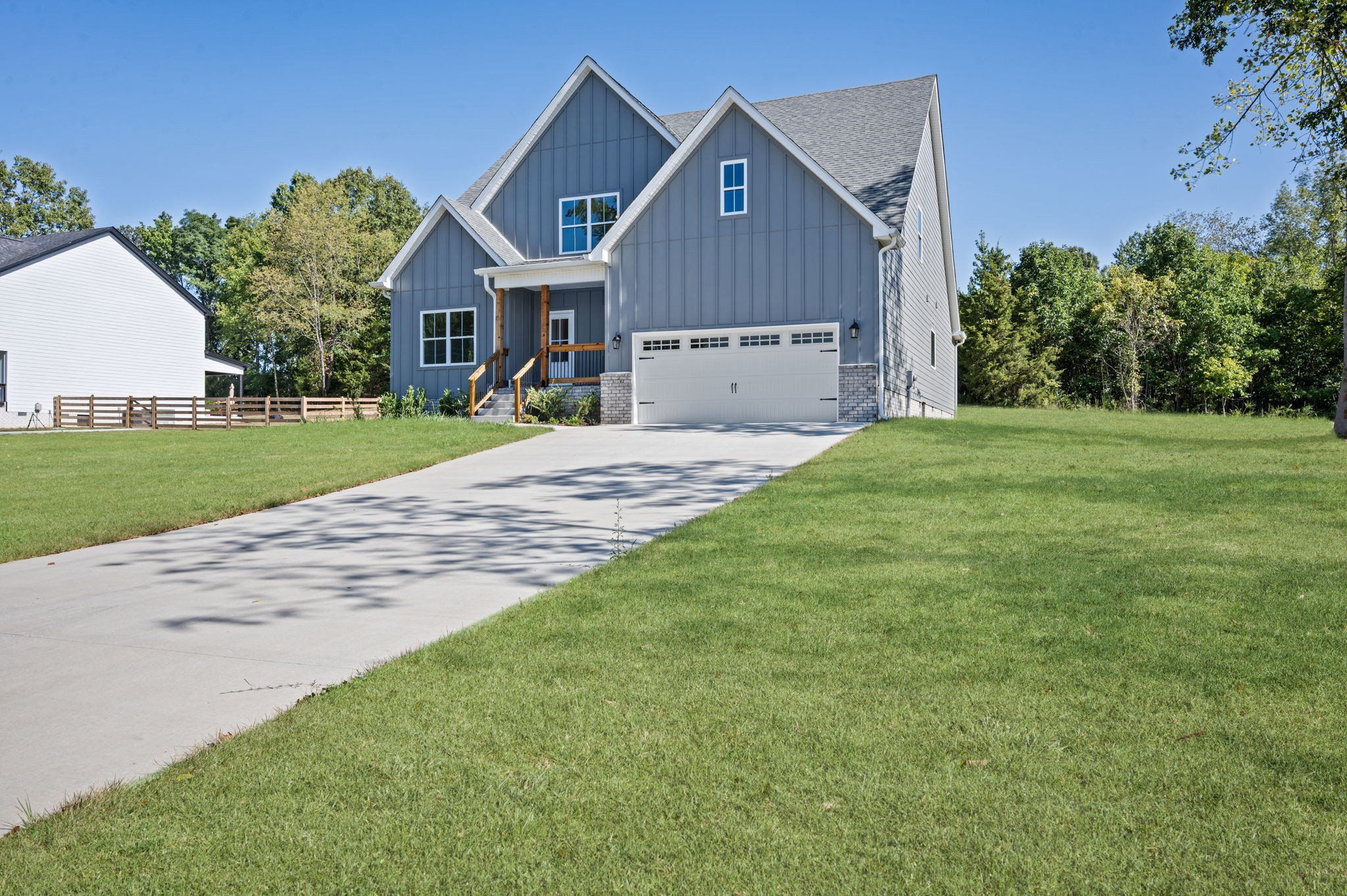 48 Powell Road Clarksville, TN 37043 - Photo 50 of 54 a front view of a house with a yard and garage