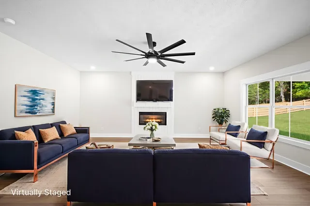 a living room with furniture and a flat screen tv