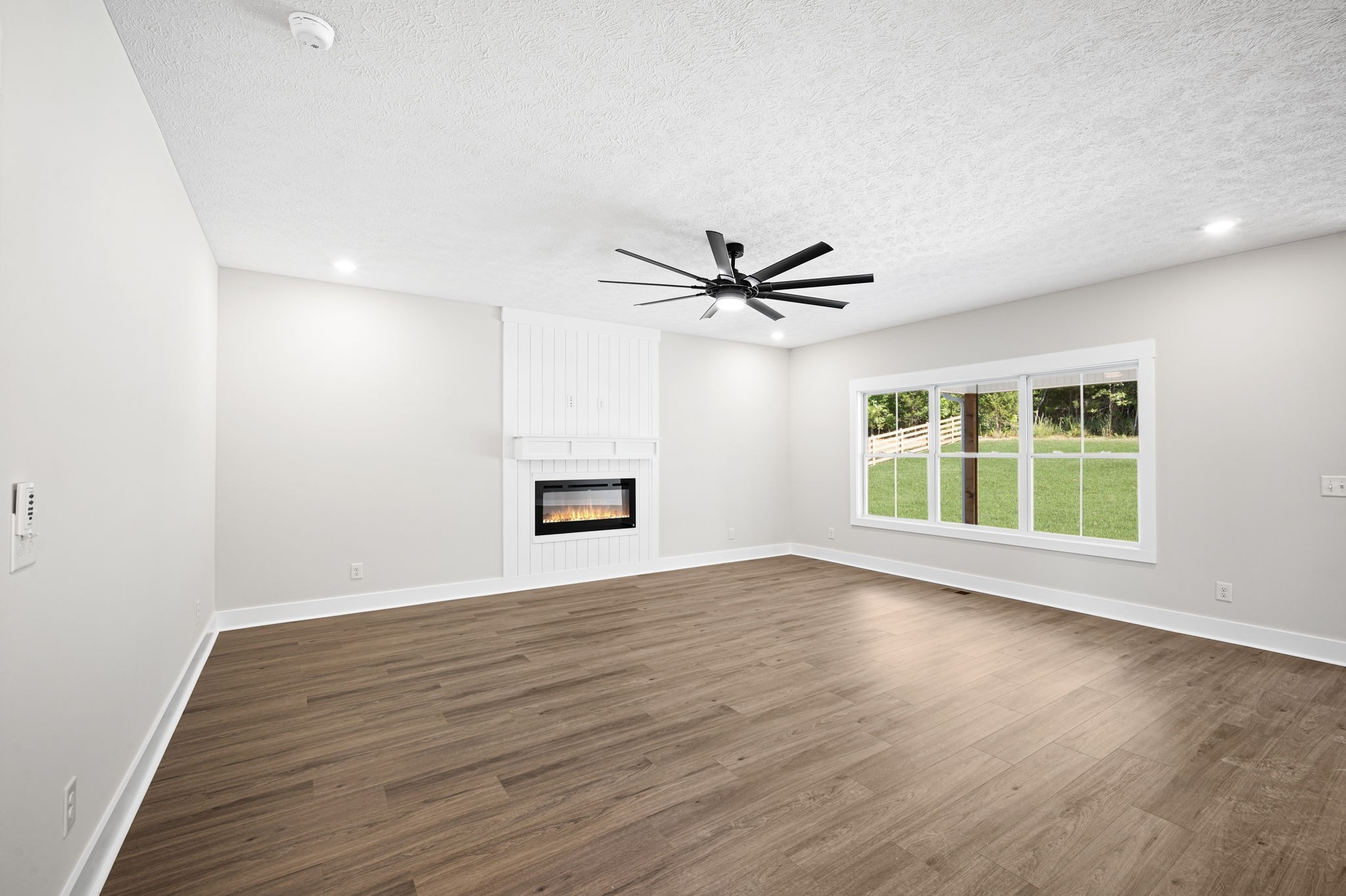 48 Powell Road Clarksville, TN 37043 - Photo 10 of 54 a view of a big room with wooden floor and windows in a room