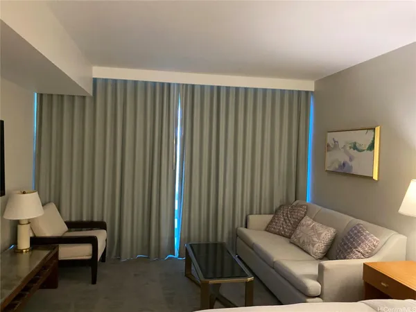 a living room with furniture and a window