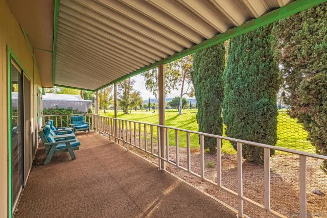 a view of two chairs in the balcony