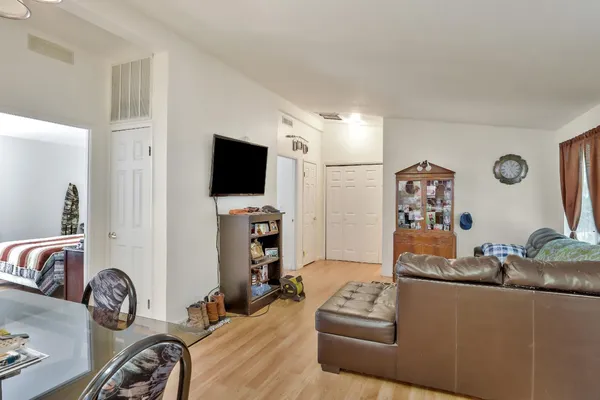 a view of a livingroom with furniture and a flat screen tv