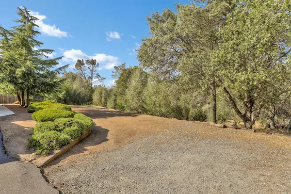 a view of a road with a yard
