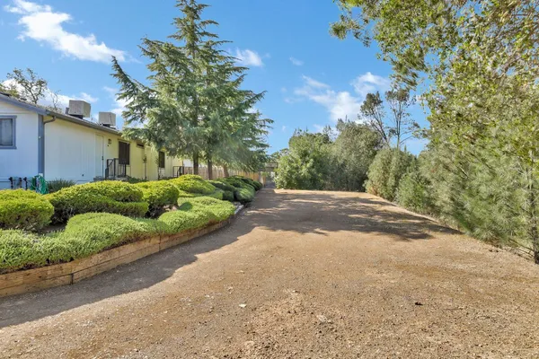 a view of a street with a house