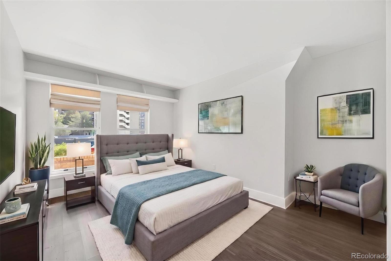 1150 Inca Street, Unit 46 Denver, CO 80204 - Photo 10 of 45 a bedroom with a bed and a couch
