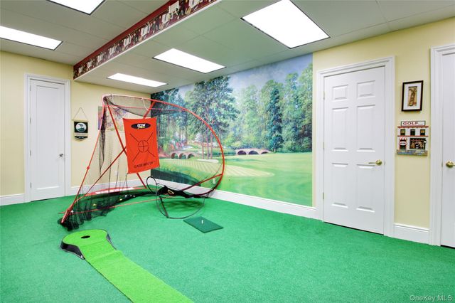 a view of a room with gym equipment and a yard