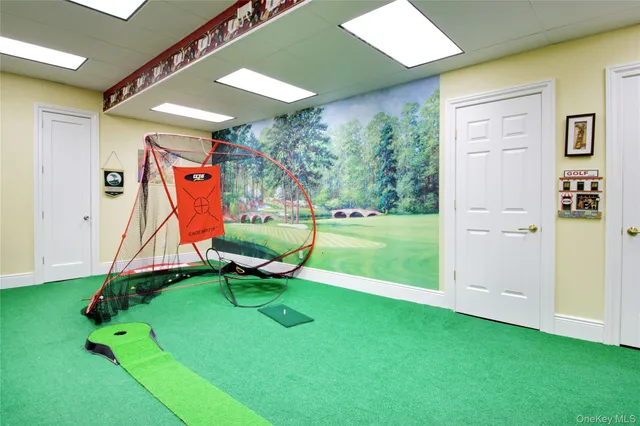 a view of a room with gym equipment and a yard