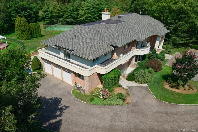 an aerial view of a house with a garden and plants